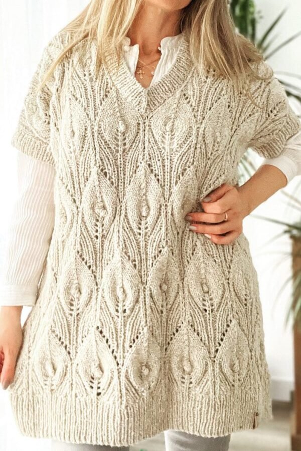 Woman wearing a Bee Leaf Vest and Tunic. Knitted vest with leaf pattern. Stylish knitwear.