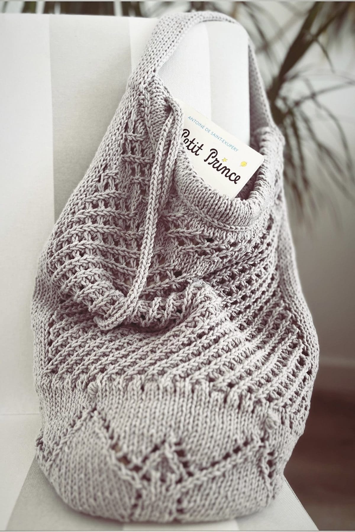 Gray knitted baby blanket with drawstring and Prince tag. Newborn essentials, baby shower gift.