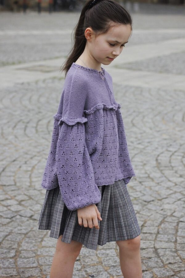 Lavender clover tunic. Ruffled knit sweater with eyelet details and bell sleeves. Fashionable knitwear.